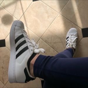 White and black Adidas superstars